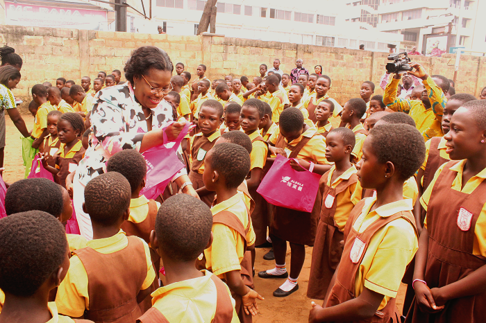 Nana Oye Lithur distributing souvenirs to some pupils of the Mantse Tackie Tawiah Basic School at Adabraka. Picture: NII MARTEY M. BOTCHWAY Electronic payment of school feeding grant saves govt GH¢24 million